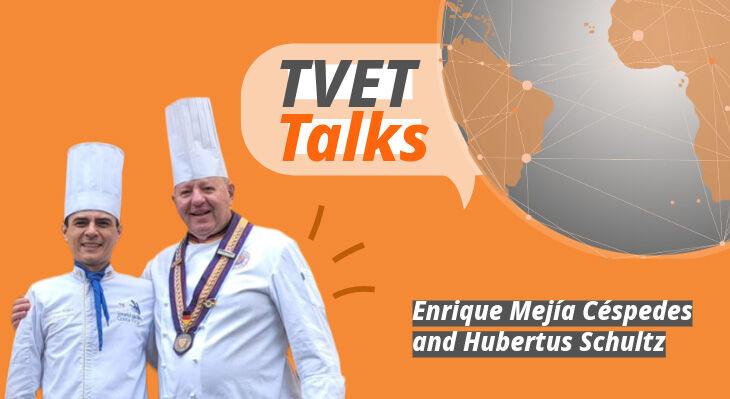 Enrique C&eacute;spedes and Hubertus Schulz hugging, in cook outfit