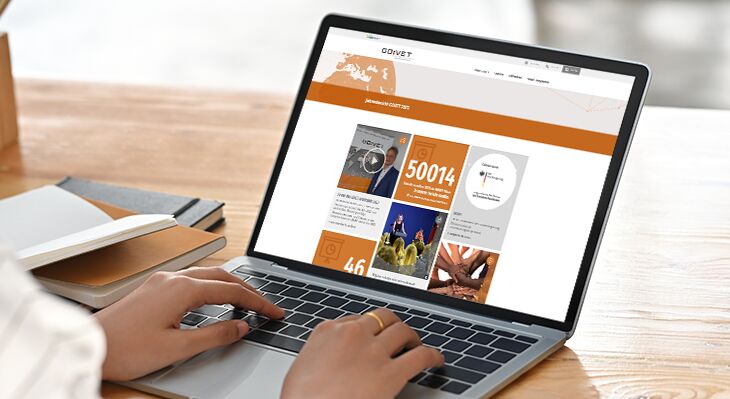 Hands tap on laptop, the GOVET online annual report is on the screen